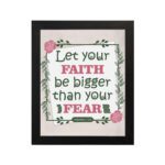 Infidu Let Your Faith Be Bigger Than Your Fear Hebrews 13:6 Christian wall art with floral border on light beige background. Wall Art hung on the wall in a black frame