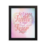 Let Your Faith Be Bigger Than Your Fear Christian wall art with pink and red script font and pastel watercolor background. Wall Art hung on the wall in black frame