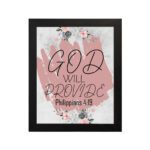 God Will Provide Philippians 4:19 Christian Wall Art with soft pink floral design Wall Art hung on the wall in black frame