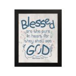 Infidu Matthew 5:8 Christian wall art with blue text on a white background, featuring a subtle pastel floral design and stylized GOD. Wall Art hung on the wall in a black frame