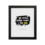 Be Still and Know That I Am God Psalm 46:10 Christian wall art with handwritten text on a navy blue background. Wall Art hung on the wall in a black frame