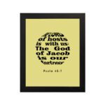 Infidu The Lord Of Hosts Is With Us Psalm 46:7 Bible Verse Wall Art on light yellow background. hung on the wall in a black frame