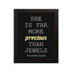 Proverbs 31:10 wall art with precious gold on a black background, featuring minimalist design and modern font. hung on the wall in a black frame