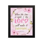 Isaiah 60:22 Christian Wall Art - When The Time Is Right, I, The Lord Will Make It Happen with floral design in pink and green. Wall Art hung on the wall in a black frame