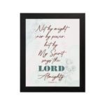 Zechariah 4:6 Christian Wall Art with minimalist design, dark brown text, and teal LORD on a light white floral background. Wall Art hung on the wall in a black frame