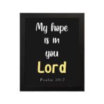 Psalm 39:7 Bible verse wall art with a black background, Lord in yellow. Christian home decor by Infidu. Wall Art hung on the wall in a black frame