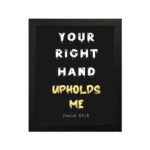 Infidu Your Right Hand Upholds Me Psalm 63:8 Bible Wall Art with a black background, yellow, and white font, and black frame hung on the wall