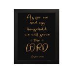 Joshua 24:15 Bible wall art with golden text on a black background, emphasizing LORD in a decorative font. hung on the wall in a black frame