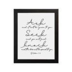 Matthew 7:7 Bible wall art in elegant cursive, highlighting Ask, Seek, and Knock on a white background. hung on the wall in a black frame