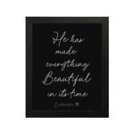 He Has Made Everything Beautiful Ecclesiastes 3:11 Christian Bible Verse Wall Art with White Text on Black Background. hung on the wall in a black frame