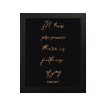 In His presence, there is fullness of joy in gold cursive text on a black background with Psalm 16:11 hung on the wall in a black frame - Christian wall art for home decor.