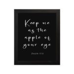 Keep Me As The Apple Of Your Eye Psalm 17:8 white cursive text on black background - Christian wall art for home decor hung on the wall in a black frame