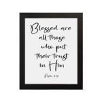 Blessed Are All Those Who Put Their Trust In Him Psalm 2:12 black cursive text on white background - Christian wall art hung on the wall in a black frame