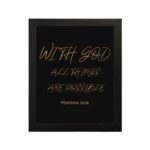 With God, All Things Are Possible Matthew 19:26 gold script on black background Christian wall art hung on the wall in black frame