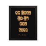 My Hope Is In You Lord' Psalm 39:7 Bible verse wall art with tan text squares on a black background. Wall Art hung on the wall in a black frame