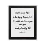 Psalm 50:15 Bible wall art with black text on white background, saying 'Call upon Me in the day of trouble; I will deliver you. Wall Art hung on the wall in a black frame