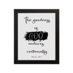 Infidu The Goodness Of God Endures Continually Psalm 52:1 Bible Wall Art with black text and brushstroke design on white background. Wall Art hung on the wall in a black frame