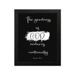 Infidu The Goodness of God Endures Continually Psalm 52:1 Bible Verse Wall Art with white text on black background. Wall Art hung on the wall in a black frame