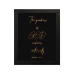 Psalm 52:1 The Goodness of God Endures Continually Bible verse wall art with gold text on a black background. Wall Art hung on the wall in a black frame