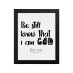 Be Still and Know That I Am God Psalm 46:10 Bible Verse Wall Art with black text on a white background Wall Art hung on the wall in a black frame