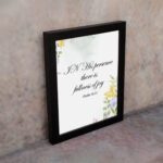 In His Presence There Is Fullness of Joy - Psalm 16:11 Bible Verse Wall Art with Pastel Floral Design on White Background Wall Art displayed on the wall in a black frame