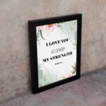 Infidu I Love You O Lord My Strength Psalm 18:1 Bible Wall Art with a green floral background and pink flowers Wall Art displayed on the wall in a black frame