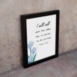 I Will Call Upon The Lord Psalm 18:3 Bible Verse Wall Art with black text on a light background and a soft blue flower in the bottom left corner. Wall Art displayed on the wall in a black frame