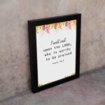 I Will Call Upon The Lord Psalm 18:3 Bible Verse Wall Art with handwritten text and colorful floral elements on a white background. Wall Art displayed on the wall in a black frame