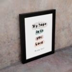 Colorful My Hope Is In You Lord Bible Verse Wall Art in soft pink, green, and blue on a white background Wall Art displayed on the wall in a black frame