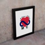 Infidu Jesus Loves Me Bible Wall Art with red heart and blue infinity symbol, with the text JESUS LOVES ME around the image Wall Art displayed on the wall in black frame