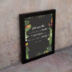 Psalm 50:15 Bible Verse Wall Art with white text, tropical leaves, and black background. Wall Art displayed on the wall in a black frame