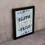 Infidu Let Your Faith Be Bigger Than Your Fear Hebrews 13:6 Christian Wall Art with blue and yellow floral design Wall Art displayed on the wall in a black frame