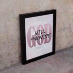 God Will Provide Philippians 4:19 Christian wall art with bold pink 'God' and handwritten 'Will Provide' on a light gray background. Wall Art displayed on the wall in a black frame