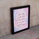 Infidu Jeremiah 18:6 Christian wall art with purple and pink cursive text, bold 'MY,' and a pastel watercolor background with a blue vine frame. Wall Art displayed on the wall in a black frame