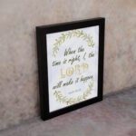 Infidu Isaiah 60:22 Christian wall art with green and gold text, gold LORD, and a wreath of green leaves on a white background. Wall Art displayed on the wall in a black frame