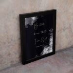 Be Still and Know That I Am God Psalm 46:10 Christian wall art with handwritten text on a navy blue background. wall art displayed on the wall in a black frame