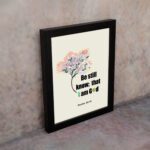 Be Still and Know That I Am God Psalm 46:10 Bible verse wall art with tree graphic, black and green text on a white background. displayed on the wall in a black frame