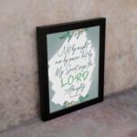 Infidu Zechariah 4:6 Christian wall art with decorative design and floral accents, featuring Not by Might, But by My Spirit. wall art hung on the wall in a black frame