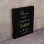 Ecclesiastes 3:11 Bible verse wall art with Beautiful yellow script on a black background. Inspiring Christian decor by Infidu. Wall Art kept on the wall in a black frame