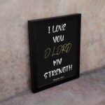 Psalm 18:1 Bible verse wall art with I LOVE YOU in white and O LORD in yellow on a black background. Christian decor by Infidu. Wall Art displayed on the wall in a black frame