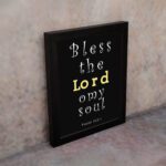 Infidu Bless The Lord O My Soul Psalm 103:1 Bible Wall Art with Black Background and Yellow, White Font black frame on the wall