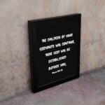 Bible verse wall art with Psalm 102:28 in bold white text on a black background. Centered and simple design for easy readability. displayed on the wall in a black frame