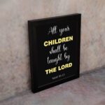 Infidu All Your Children Shall Be Taught By The Lord Isaiah 54:13 Bible Verse Wall Art with Purple Blue background, black leaf design, and white font black frame on the wall