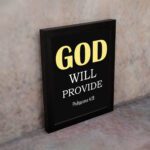 Christian wall art with Philippians 4:19 verse on black background, yellow and white font black frame on the wall