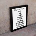 Infidu wall art displays The Fruit of the Spirit with values like Love, Joy, Peace, and more on a black background. Wall Art displayed on the wall in a black frame