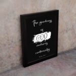 Infidu The Goodness of God Endures Continually Psalm 52:1 Bible Verse Wall Art with white text on black background. Wall Art displayed on the wall in a black frame