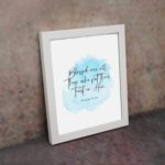 Serene Bible verse wall art with Psalm 2:12 and soft blue watercolor design, perfect for peaceful home decor. Wall Art displayed on the wall in a white frame