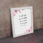 I Will Call Upon The Lord Psalm 18:3 Bible Verse Wall Art with black text on a white background, featuring pink floral decorations in the corners. Wall Art displayed on the wall in a white frame