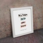 Colorful My Hope Is In You Lord Bible Verse Wall Art in soft pink, green, and blue on a white background Wall Art displayed on the wall in a white frame