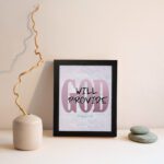 God Will Provide Philippians 4:19 Christian wall art with bold pink 'God' and handwritten 'Will Provide' on a light gray background. Wall Art displayed on the wall in a black frame